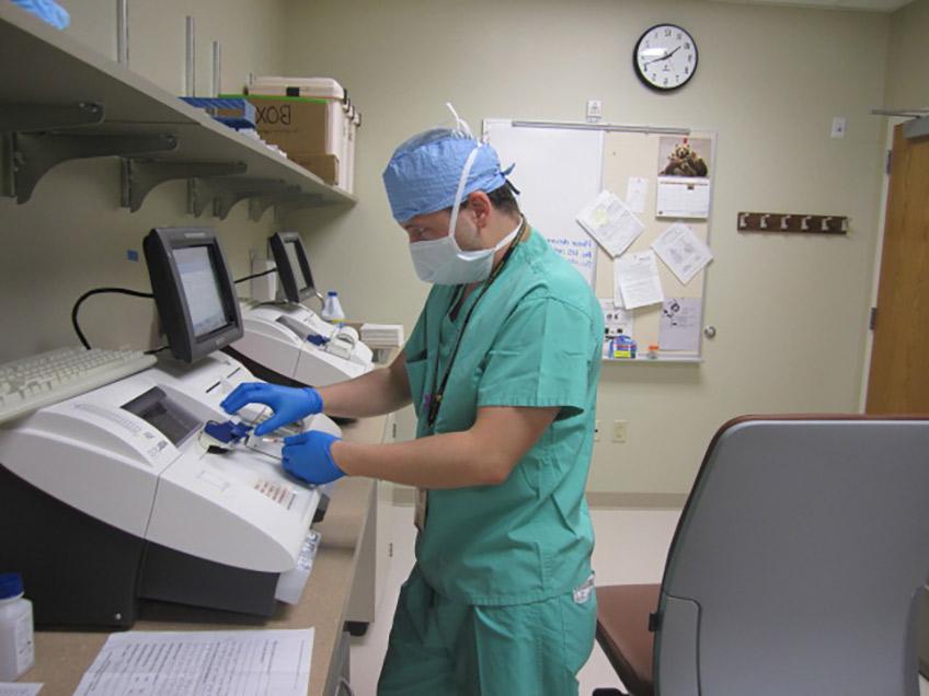 Student training in the OR lab during his clinical rotation