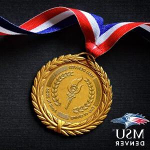 Social media profile image for Day of Giving with a gold medal on a black background
